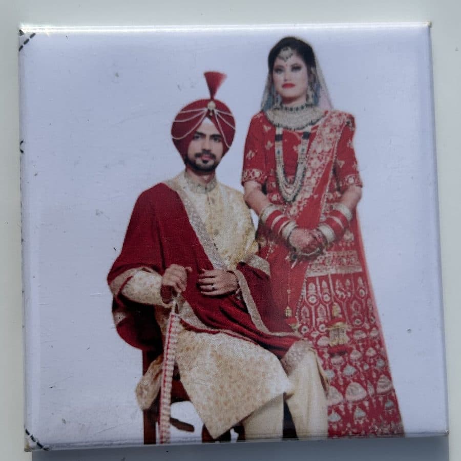 Finished photo magnet of a couple in traditional wedding attire